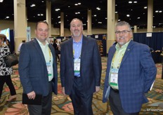Walking the floor are Kraig Loomis and Dan Acevedo with GreenFruit Avocados. In the middle Jeff Kelly with Veg-Fresh Farms.